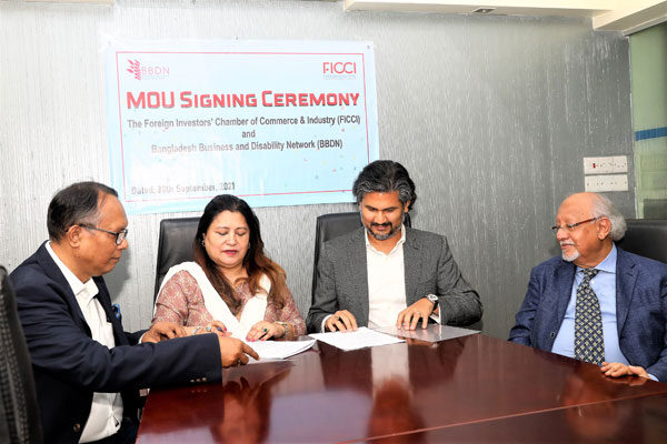 Rupali Chowdhury and Murteza Khan along with Nurul Kabir and Salahuddin Kashem Khan, signing the MoU