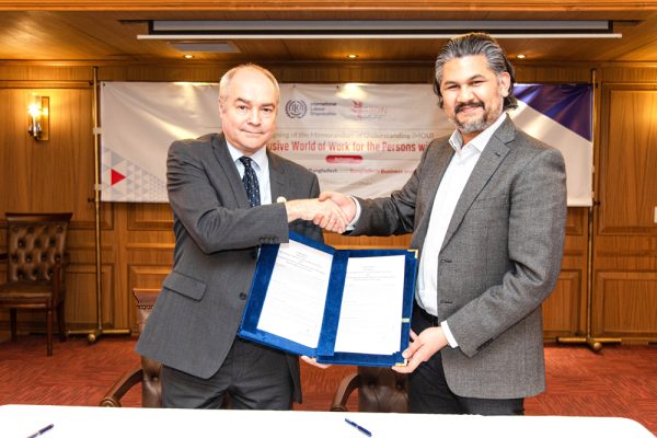 Tuomo Poutiainen, ILO Country Director, and Murteza Khan, CEO of BBDN, Seal Partnership with a Handshake.