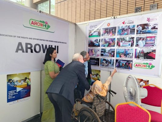 Honorable guests are visiting the stall of the organization of people with disabilities.