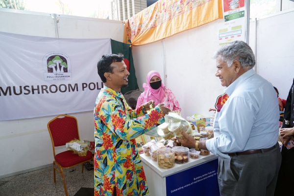 Honorable guests are visiting the stalls of entrepreneurs with disabilities.