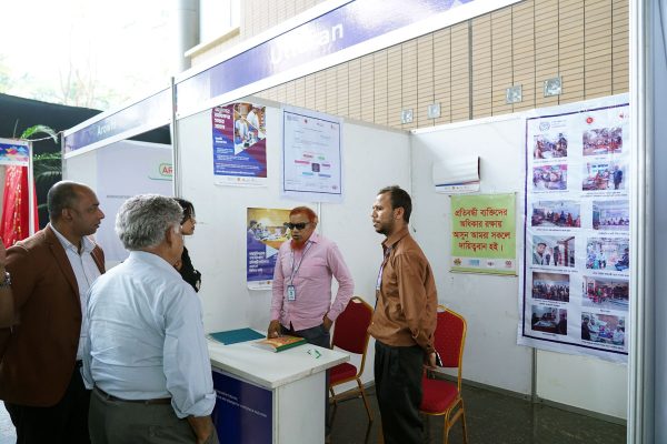 Honorable guests are visiting the stall of the organization of people with disabilities.