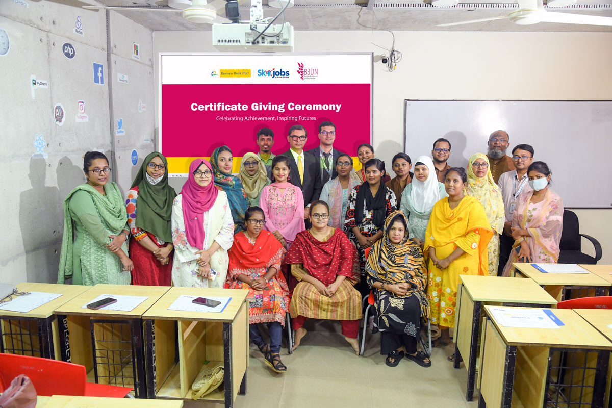 Group photo of guests and trainees with disabilities at the certificate giving ceremony.