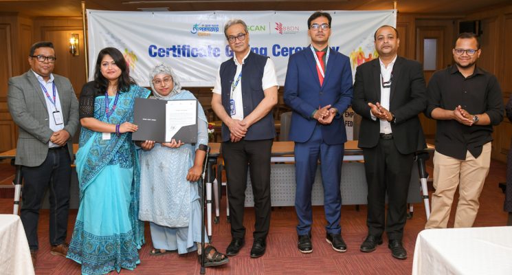 Part of trainees receiving certificates from the honored guests at the event.