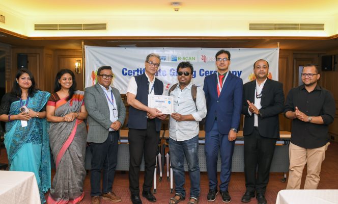 Part of trainees receiving certificates from the honored guests at the event.