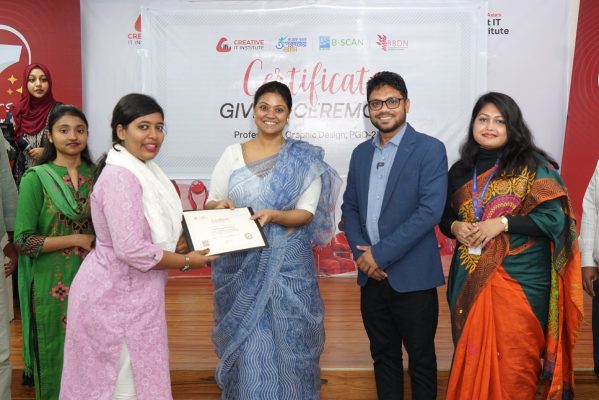 A trainee receiving a certificate from the guests.